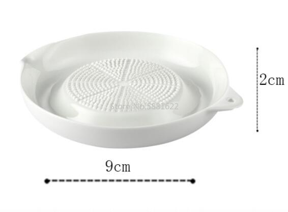 https://stateless.sellful.com/2020/10/7d5b63c0-white-simple-style-ceramic-burnishing-machine-portable-porcelain-carrot-ginger-grinding-household-burnishing-machine.jpg