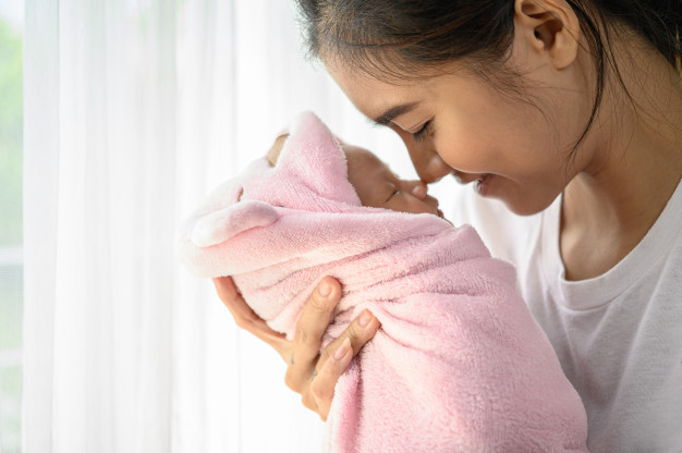 a70192d6 newborn baby sleeping hands mother nose collided 1150 19523