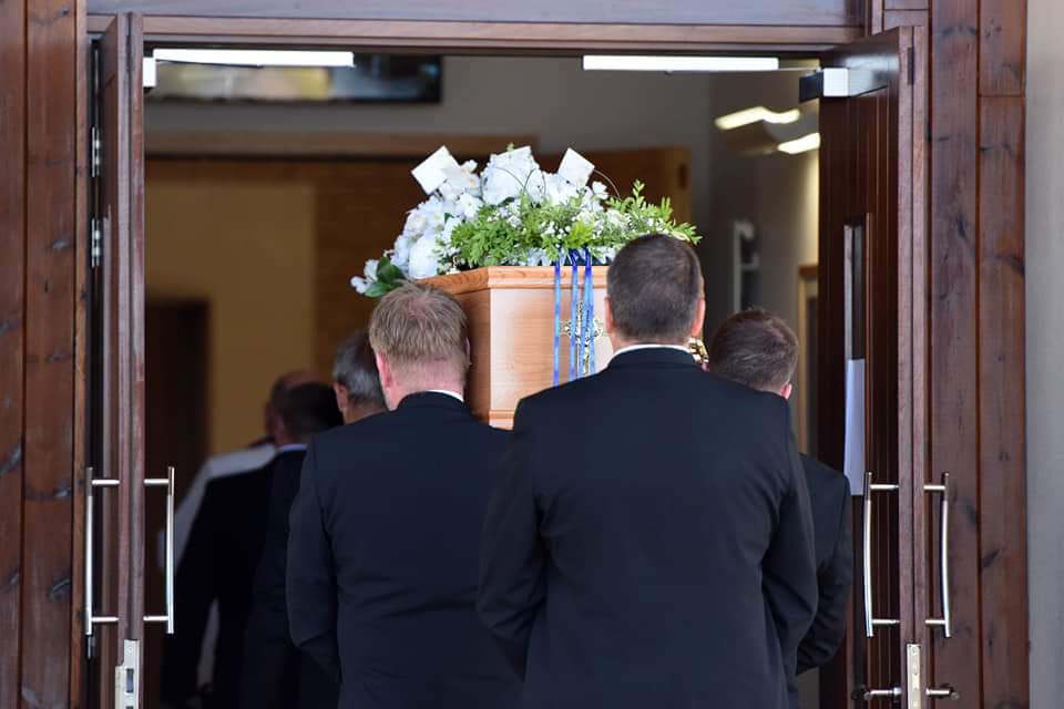 Registering a death 3 Jackson Family Funeral Directors traditionally shouldering a coffin